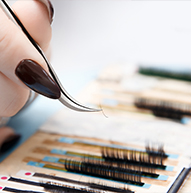 Tweezers used to pick up miniscule lashes